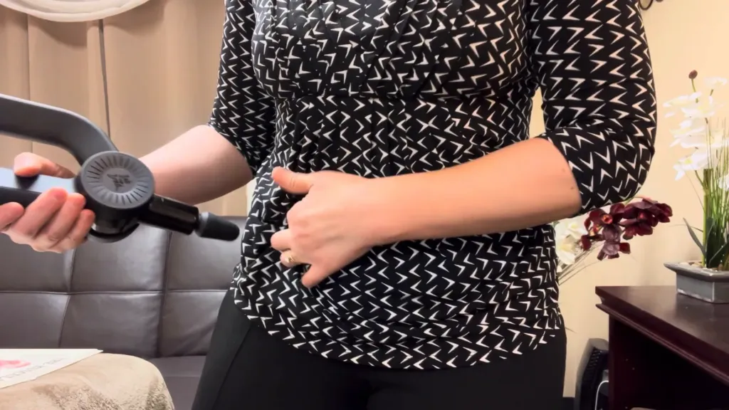 Demonstration of using a massage gun on tight hip flexors Massage tight hip flexors