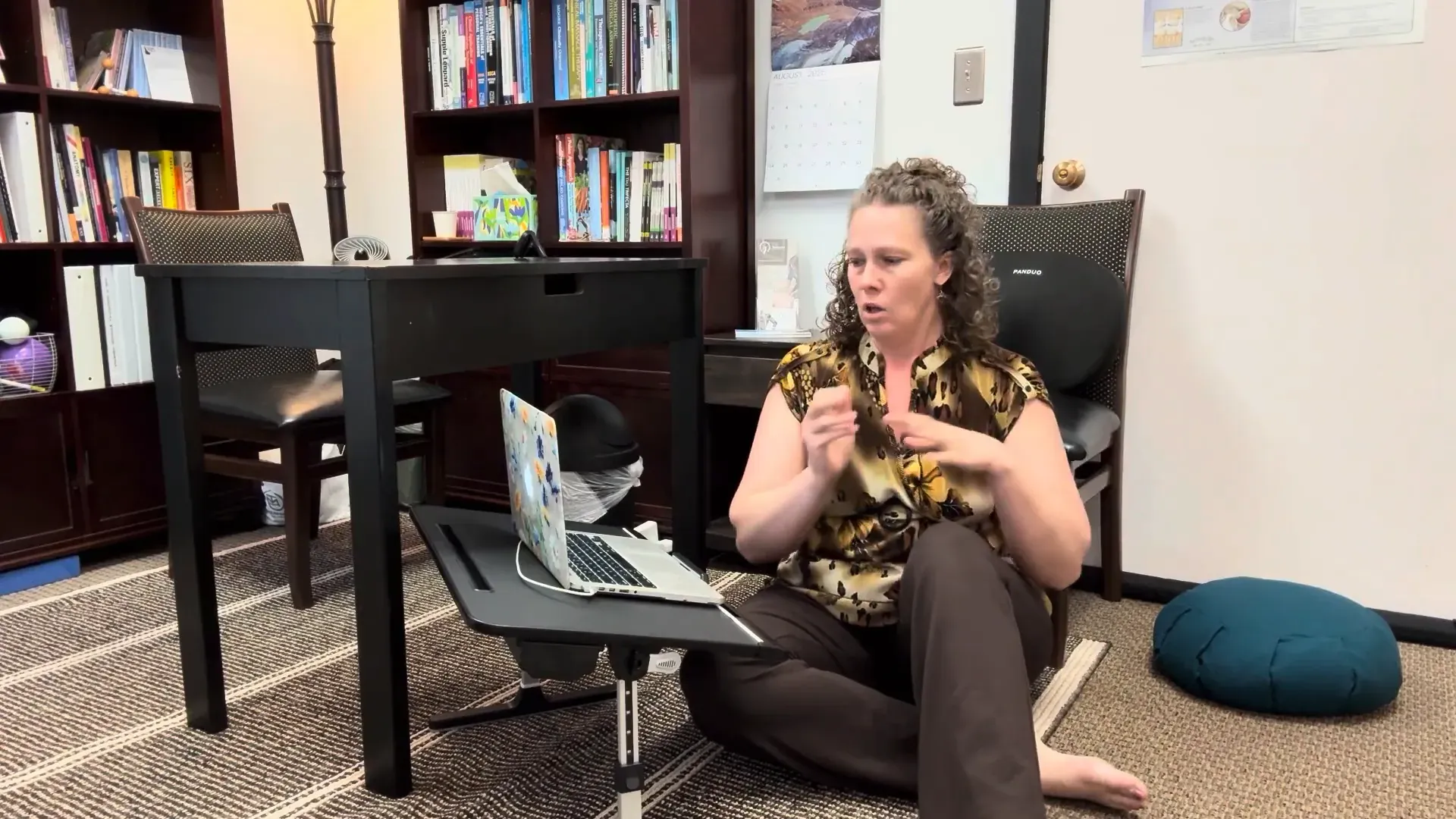 Demonstrating micro-movements while seated on the floor