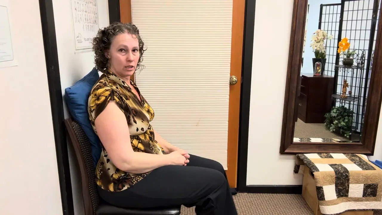 Travel pillow used as a lumbar support while sitting.